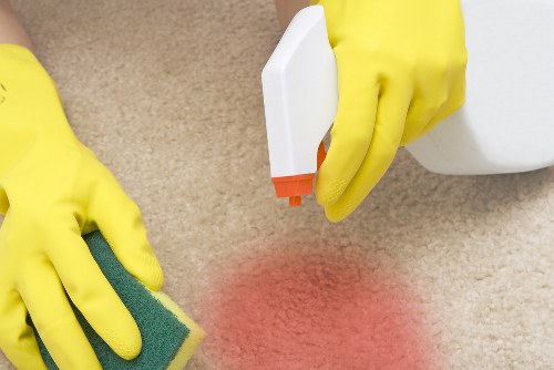 Deep cleaning kitchen surfaces and fixtures in a Bow property
