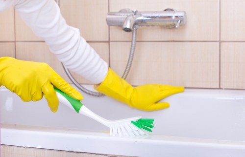Local office cleaner maintaining a meeting room in Bow